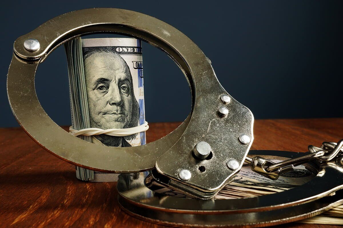 Penalty or bail bond concept. Money and handcuffs.